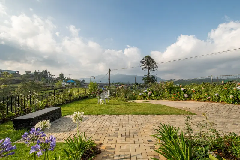 The courtyard and lawn under a big sky